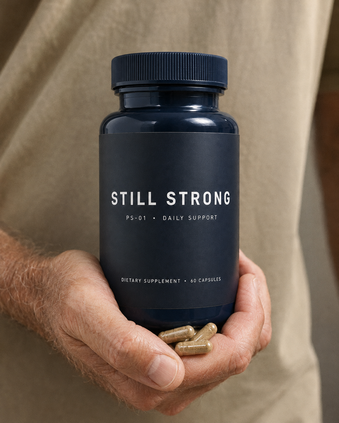 Still Strong bottle held in an open hand